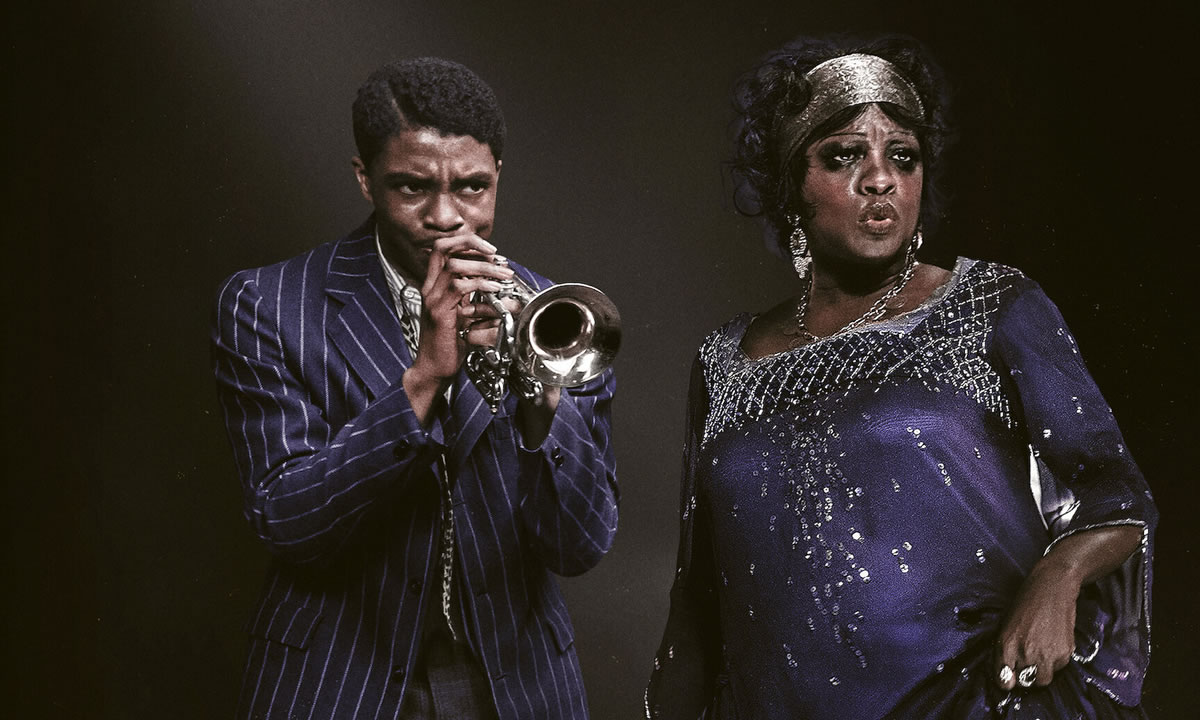 Na imagem, vê-se os dois protagonistas, o trompetista Levee (Chadwick Boseman) e a cantora Ma Rainey (Viola Davis), dividindo os holofotes do palco num concerto de blues.