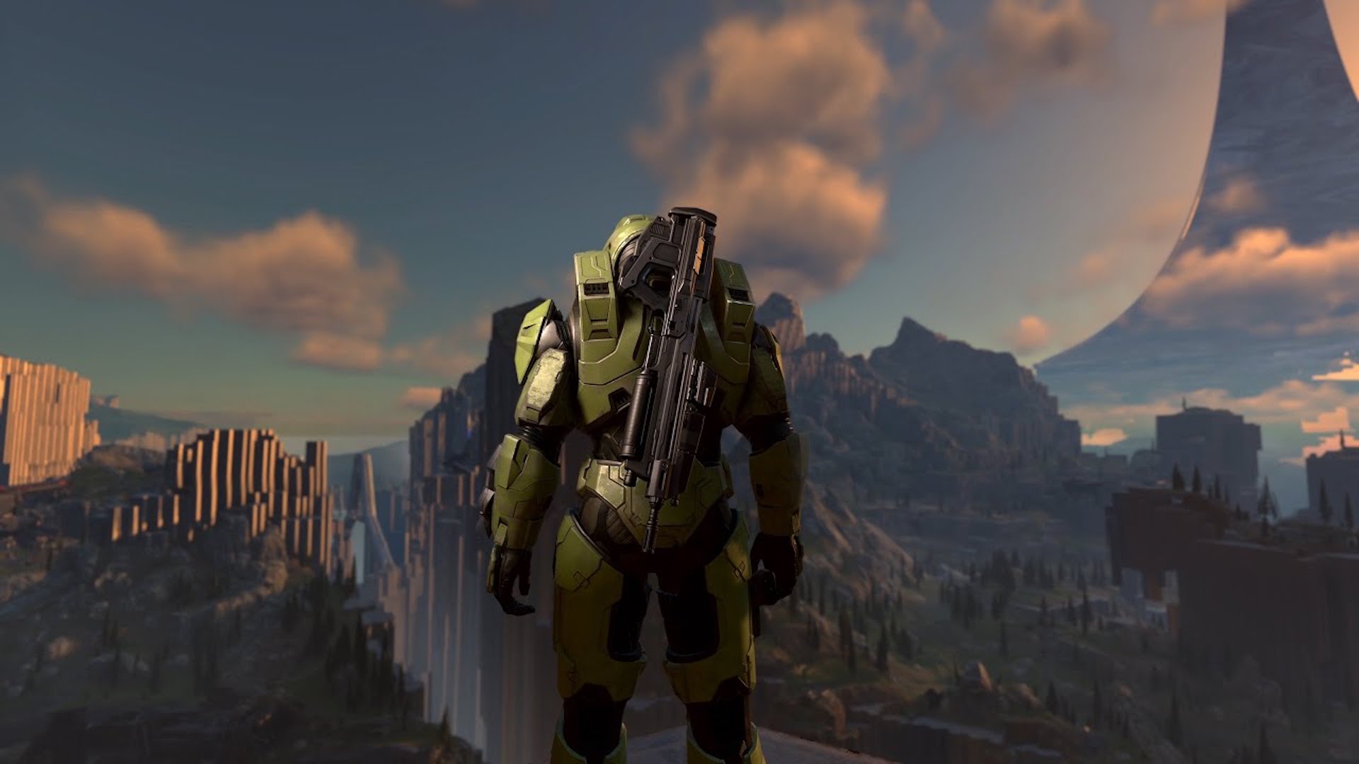 Cena do jogo Halo Infinite que mostra o protagonista Master Chief mirando uma paisagem de montanhas.