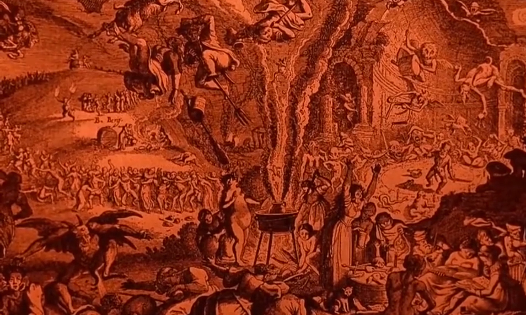Cena do filme Häxan - A Feitiçaria Através dos Tempos apresenta uma imagem com tons avermelhados que ilustra bruxas e demônios reunidos.