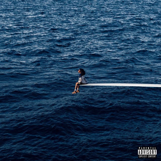 Capa do álbum SOS. Na imagem, SZA está sentada em um trampolim com apenas o mar à sua volta.