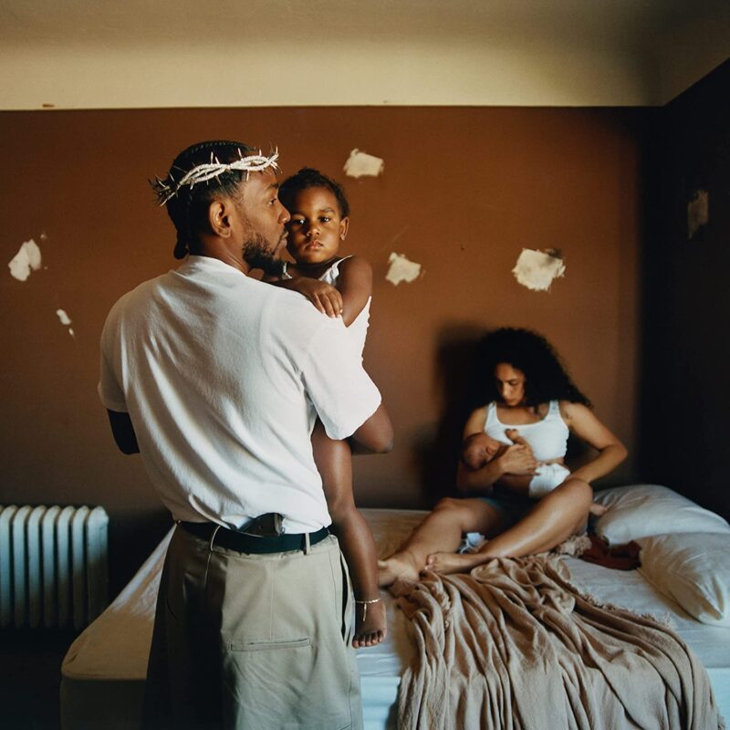 A capa do álbum mostra, na frente, Kendrick Lamar em um quarto, de costas segurando seu filho no colo, o cantor usa uma coroa de espinhos na cabeça e uma arma na cintura. Atrás, sentada na cama bagunçada, está Whitney Alford, sua esposa, segurando o segundo filho do casal.
