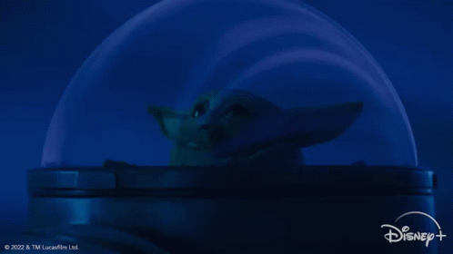 Cena da terceira temporada de The Mandalorian. No gif, Grogu aparece encantando com as luzes do universo enquanto viaja em seu compartimento na nave de Mando.