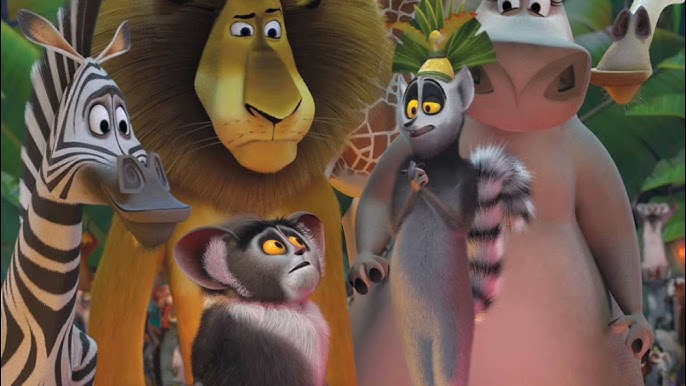 Cena do filme Madagascar. Na imagem tem foco em Rei Julien e Maurice, dois lêmures. Ao fundo, Martin parece feliz, assim como Glória, já Alex e Melman parecem confusos e desconfiados. Os animais se encontram na floresta.