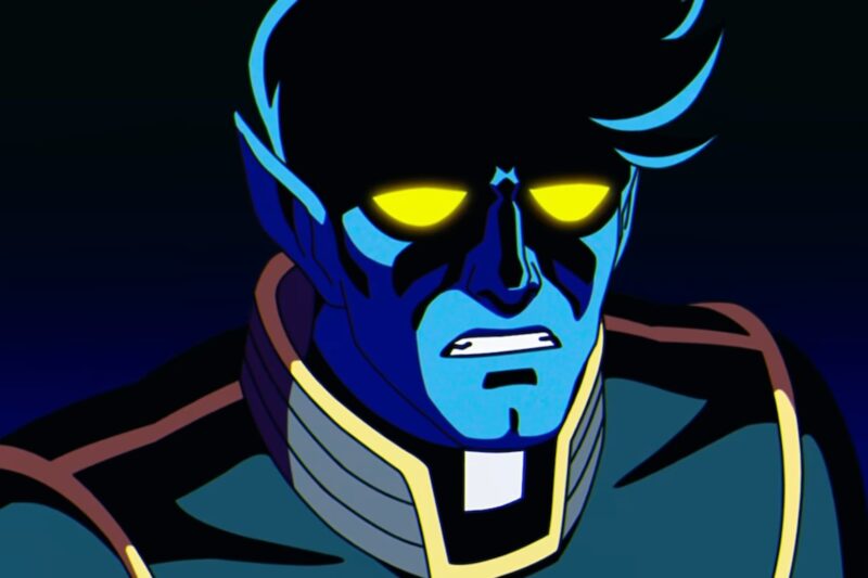 Cena da série X-Men ‘97Na imagem, o personagem Noturno, de pele azul escura e olhos amarelos, está com uma expressão de preocupação. Ele veste um uniforme preto com linhas amarelas nos braços e ombros por cima de uma roupa de padre, com o colarinho aparente. Noturno tem cabelo em topete na cor preta. 